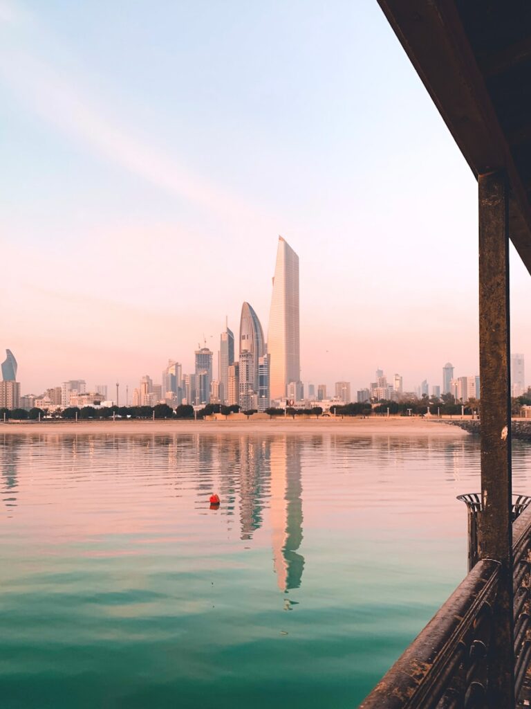 a body of water with a city in the background
